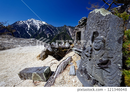 Stone Buddha of Mount Kurakake and remaining snow on Mount Kaikoma 121346048