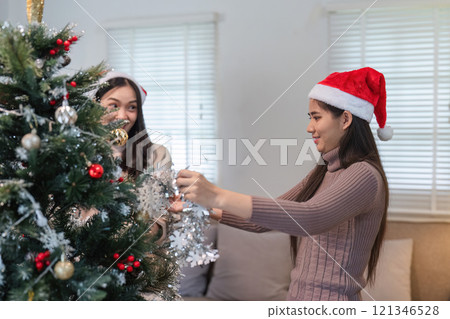 Joyful Lesbian Couple Celebrating Special Day with Thoughtful Reflections and Festive Cheer 121346528