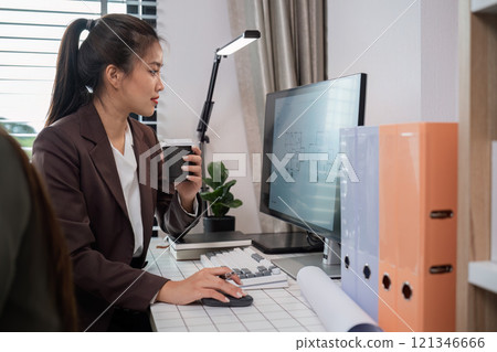 Confident Businesswoman Analyzing Data on Tablet in Modern Office Environment with Laptop and Documents Confident Businesswoman Analyzing Data on Tablet in Modern Office Environment with Laptop and Documents 121346666
