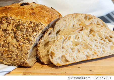 Homemade bread, sourdough wheat loaf with seeds Homemade bread, sourdough wheat loaf with seeds 121347004