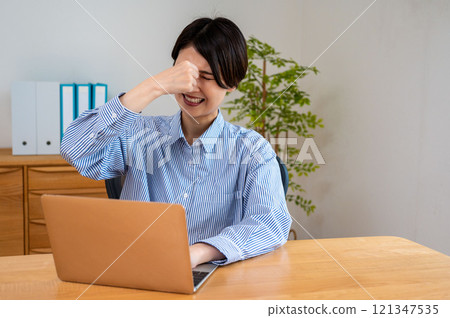 Women suffering from exhaustion Women suffering from exhaustion 121347535