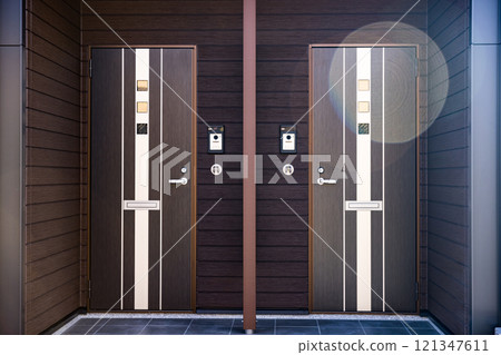 Entrance door of rental apartment building 121347611