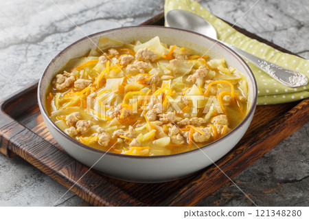 Diet winter egg roll soup with minced meat, vegetables and spices close-up in a bowl. Horizontal Diet winter egg roll soup with minced meat, vegetables and spices close-up in a bowl. Horizontal 121348280