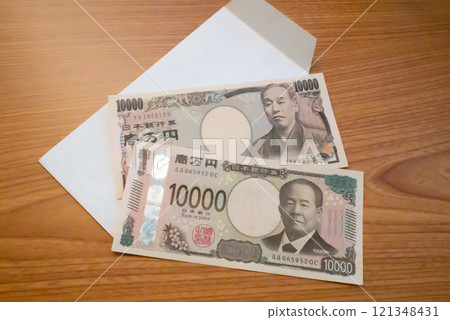 Stock photo of new and old 10,000 yen bills 121348431