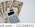 New 10,000 yen note and calculator - stock photo 121348432