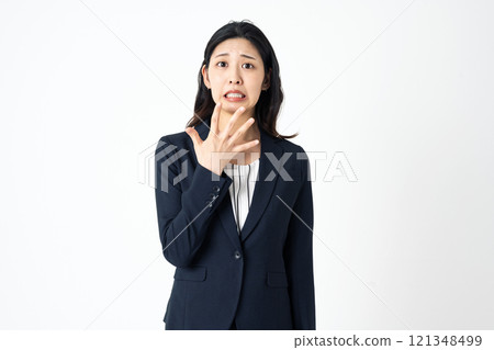 Shocked young woman in a suit Shocked young woman in a suit 121348499