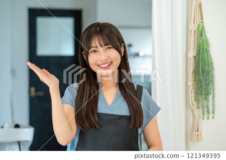 Female staff member giving guidance Female staff member giving guidance 121349395