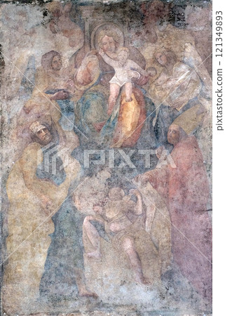 Virgin Mary with baby Jesus and Saints fresco on Palazzo Pretorio or Palazzo del Podesta in Lucca, Tuscany, Italy 121349893