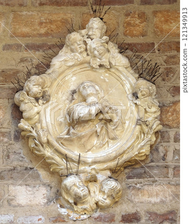 Virgin Mary relief on facade of church in Verona, Italy Virgin Mary relief on facade of church in Verona, Italy 121349913