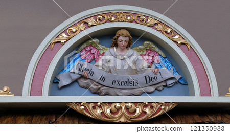 Angel with Gloria in excelsis Deo Banner, Nativity Scene, altarpiece in the church of Saint Matthew in Stitar, Croatia 121350988