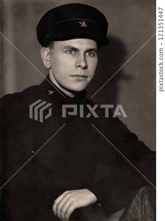 Vintage portrait of a young man in the uniform of a USSR railway worker. Retro photo from 1937 Vintage portrait of a young man in the uniform of a USSR railway worker. Retro photo from 1937 121351447