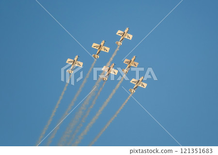 Stunt aerobatic planes performing stunts in air 121351683