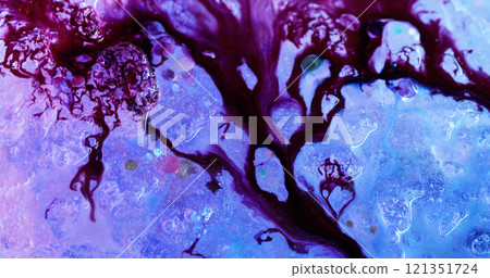 Paint flow. Contrast spill. Branching stream of dark red ink on luminous defocused sparkling ice. Color washing surface decorative explosion. 121351724