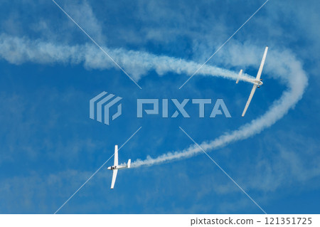 Stunt aerobatic plane performing stunts in air 121351725