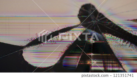 Defective screen. Cracked LCD. Color grainy display with chaotic glitchy splits. Poor quality image with black defocused shapeless dead spot. 121351741