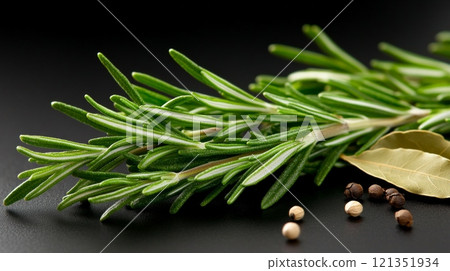 Fresh Rosemary and Peppercorns on Dark Surface  121351934