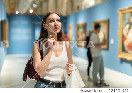Girl view pictures and icons in museum hall Girl view pictures and icons in museum hall 121351962