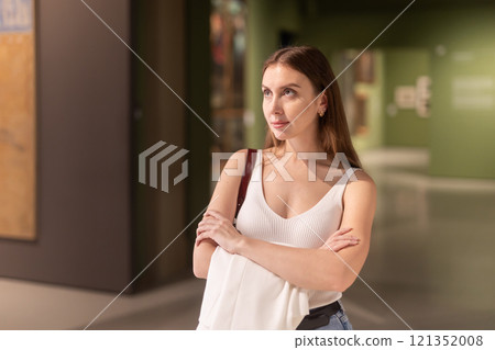 Woman with a smile in the museum 121352008