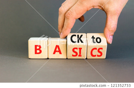 Back to basics symbol. Concept words Back to basics on wooden block. Beautiful grey table grey background. Businessman hand. Business back to basics concept. Copy space. 121352733