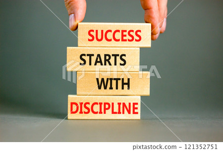 Success starts with discipline symbol. Concept words Success starts with discipline on beautiful wooden blocks. Beautiful grey background. Business success starts with discipline concept. Copy space 121352751