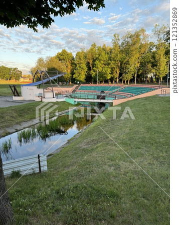 Outdoor Amphitheater with Reflective Pond at Sunset Outdoor Amphitheater with Reflective Pond at Sunset 121352869