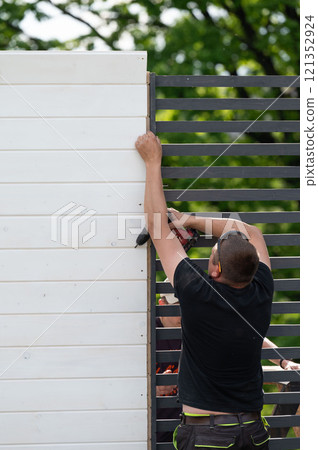 Aligning and screwing together the components of a wooden gazebo, Aligning and screwing together the components of a wooden gazebo, 121352924