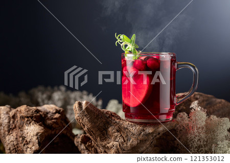 Hot drink with cranberries, lime, and rosemary. Hot drink with cranberries, lime, and rosemary. 121353012