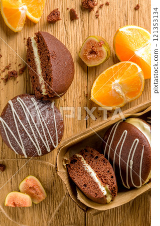 Whoopie pie with orange cream. Delicious homemade dessert. 121353134