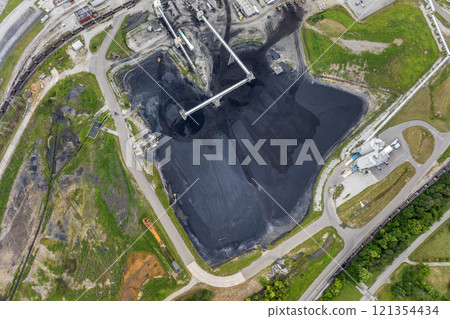 Coal stack at thermal Kingston power plant in Roane County, Tennessee. Coal used as fossil fuel for electric energy production in American grid Coal stack at thermal Kingston power plant in Roane County, Tennessee. Coal used as fossil fuel for electric energy production in American grid 121354434