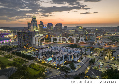 Cincinnati Ohio USA night urban landscape. Downtown district skyline with brightly illuminated high skyscraper buildings in modern American megapolis Cincinnati Ohio USA night urban landscape. Downtown district skyline with brightly illuminated high skyscraper buildings in modern American megapolis 121354485
