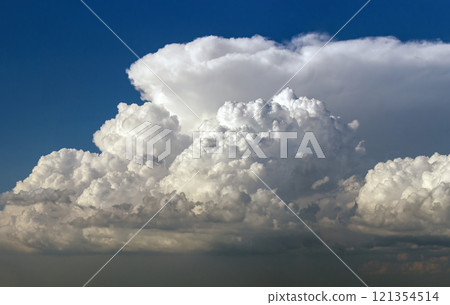 Bright landscape of blue sky with flying white clouds. Colorful summer skyscape 121354514