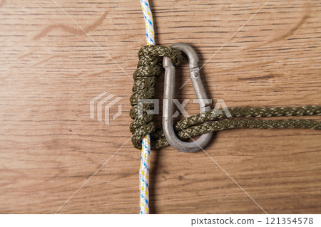 Carabiner and Rope. Grasping Oblique. Austrian Klemheist Knot. Climbing and Nautical Applications. 121354578