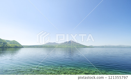 Fresh greenery of Lake Shikotsu, Mt. Tarumae, and Mt. Fufusidake 16:9 Chitose City 121355797