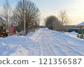 Snowy European village road on a sunny day in December. High quality photo 121356587