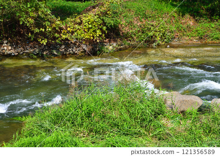 Early autumn scenery of the Usune River, a tributary of the Tone River, Numata City, Gunma Prefecture 121356589