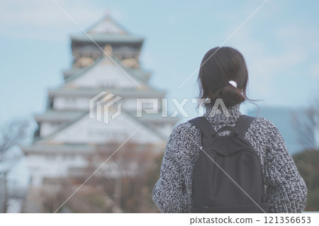 Osaka Castle and the back of a female tourist Osaka Castle and the back of a female tourist 121356653