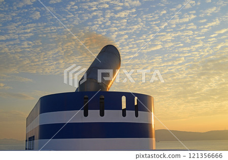 Morning sky over Awaji Island and the funnels of a ferry boat 121356666
