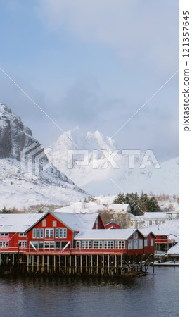 Traditional fishing village A on Lofoten Islands, Norway with red rorbu houses. With snow in winter 121357645