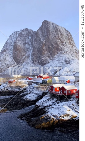 Hamnoy fishing village on Lofoten Islands, Norway with red rorbu houses. With falling snow in winter 121357649