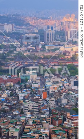 Aerial view of Seoul downtown cityscape with Gyeongbokgung Palace on sunset from Inwang mountain. Seoul, South Korea. 121357702