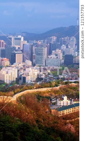 Aerial view of Seoul downtown cityscape and Namsan Seoul Tower on sunset from Inwang mountain. Seoul, South Korea. Aerial view of Seoul downtown cityscape and Namsan Seoul Tower on sunset from Inwang mountain. Seoul, South Korea. 121357703