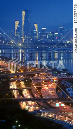Aerial view of Seoul downtown cityscape and Seongsan bridge over Han River in twilight. Seoul, South Korea. 121357706