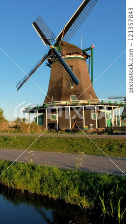 Windmills at famous tourist site Zaanse Schans in Holland. Zaandam, Netherlands 121357843