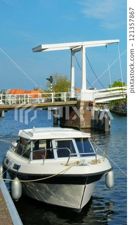 Spaarne river with Gravestenenbrug bridge. Harlem, Netherlands Spaarne river with Gravestenenbrug bridge. Harlem, Netherlands 121357867