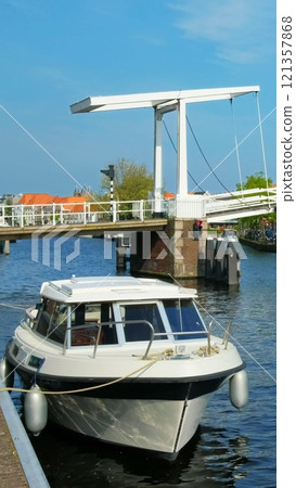 Spaarne river with Gravestenenbrug bridge. Harlem, Netherlands Spaarne river with Gravestenenbrug bridge. Harlem, Netherlands 121357868