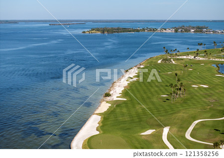 Big golf course field with green grass in Boca Grande, small town on Gasparilla Island in southwest Florida 121358256