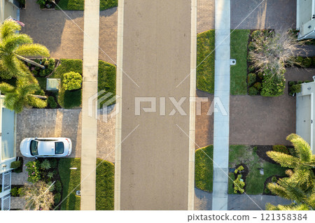 American gated community houses in rural US suburbs. View from above of large residential homes in small town in southwest Florida 121358384