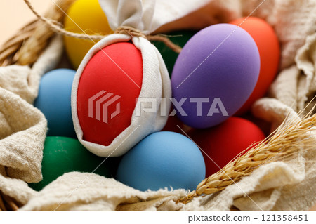 Happy Easer eggs in a basket 121358451
