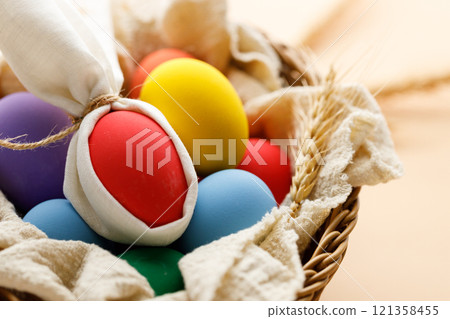 Happy Easer eggs in a basket Happy Easer eggs in a basket 121358455