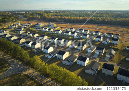 Aerial view of tightly located new family houses in South Carolina suburban area. Real estate development in american suburbs 121358473